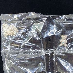 NIP Avon March Birthstone Teddy Necklace